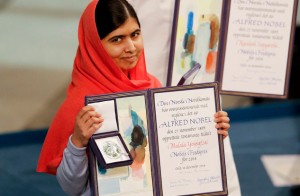 Nobel Peace Prize laureate Yousafzai poses with the medal and the diploma during the Nobel Peace Prize awards ceremony at the City Hall in Oslo