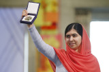 Nobel Peace Prize laureate Yousafzai poses with her medal during the Nobel Peace Prize awards ceremony at the City Hall in Oslo
